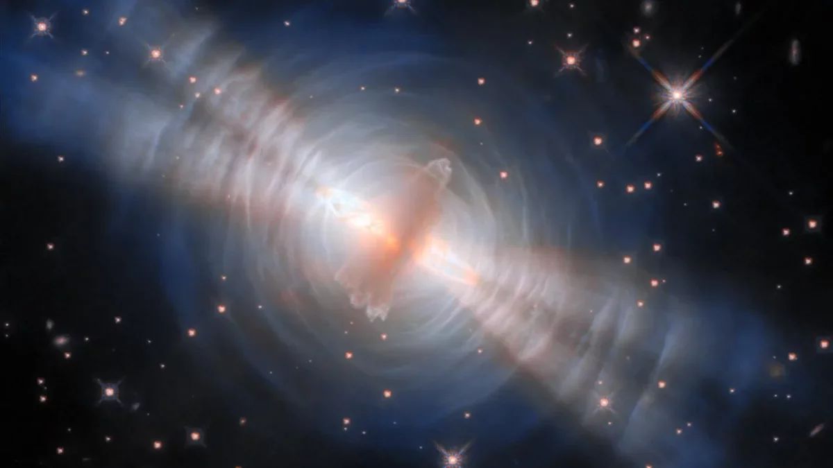Stunning Hubble Image Reveals Twin Beams from Hidden Star in Egg Nebula